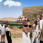Tour guide and tourists selfie during 3-day Fes to Marrakech desert tour near Merzouga with High Atlas Mountains