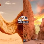 Berber guide with camels during a scenic break on the Marrakech to Fes Desert Tour 4 Days